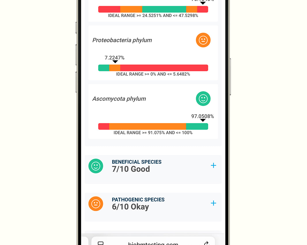 Smartphone displaying a biome testing app with various percentages and categories on the screen.