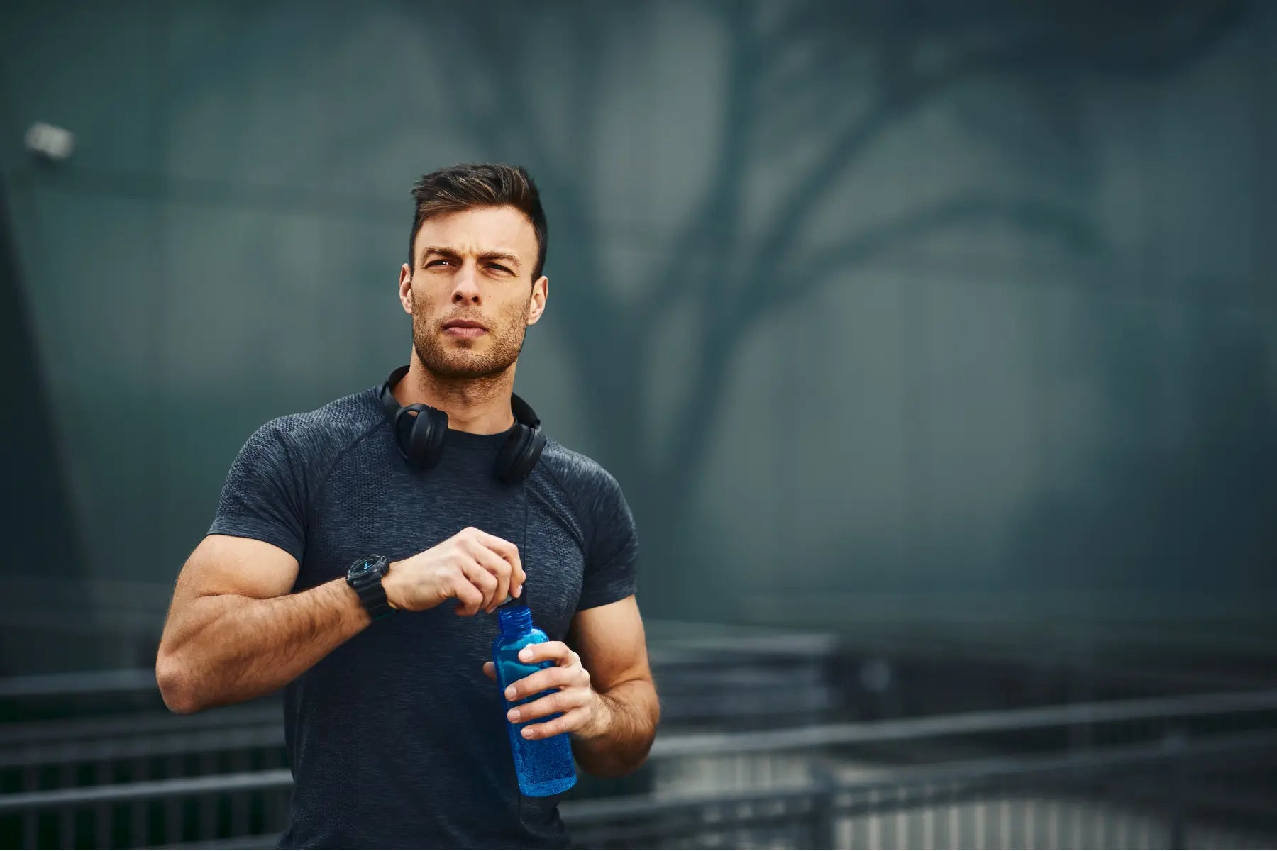 DEXA for body fat athlete hydrating after workout to prepare for accurate body composition testing.