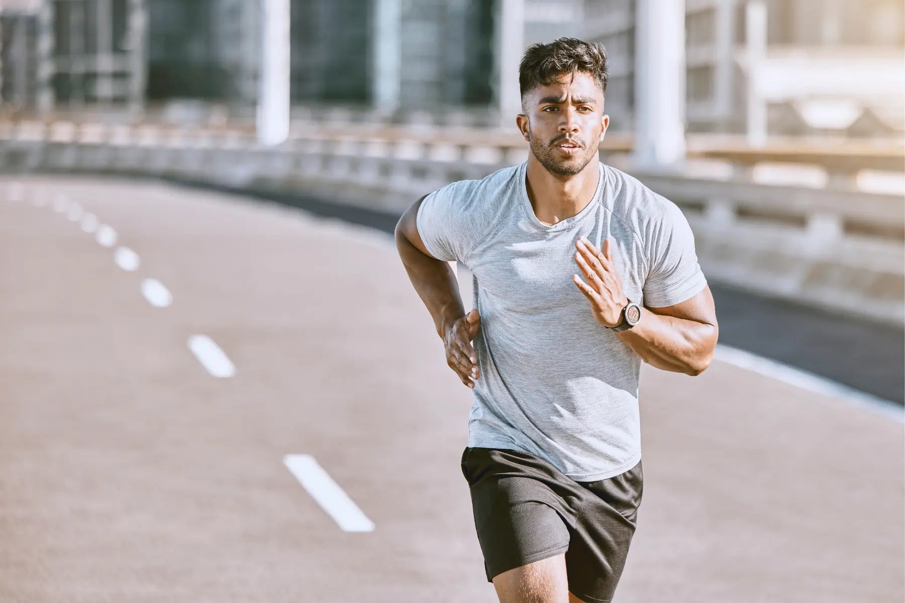 Body composition testing benefits illustrated by a man running outdoors to improve fitness, endurance, and muscle-to-fat ratio
