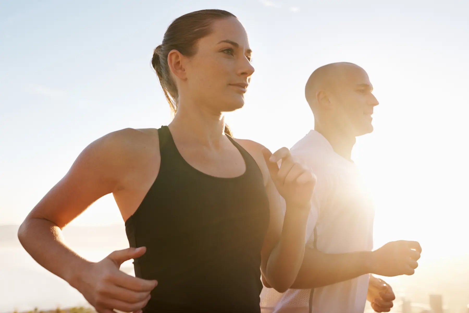 Bone density safety promoted by two people running outdoors to support strong, healthy bones through exercise