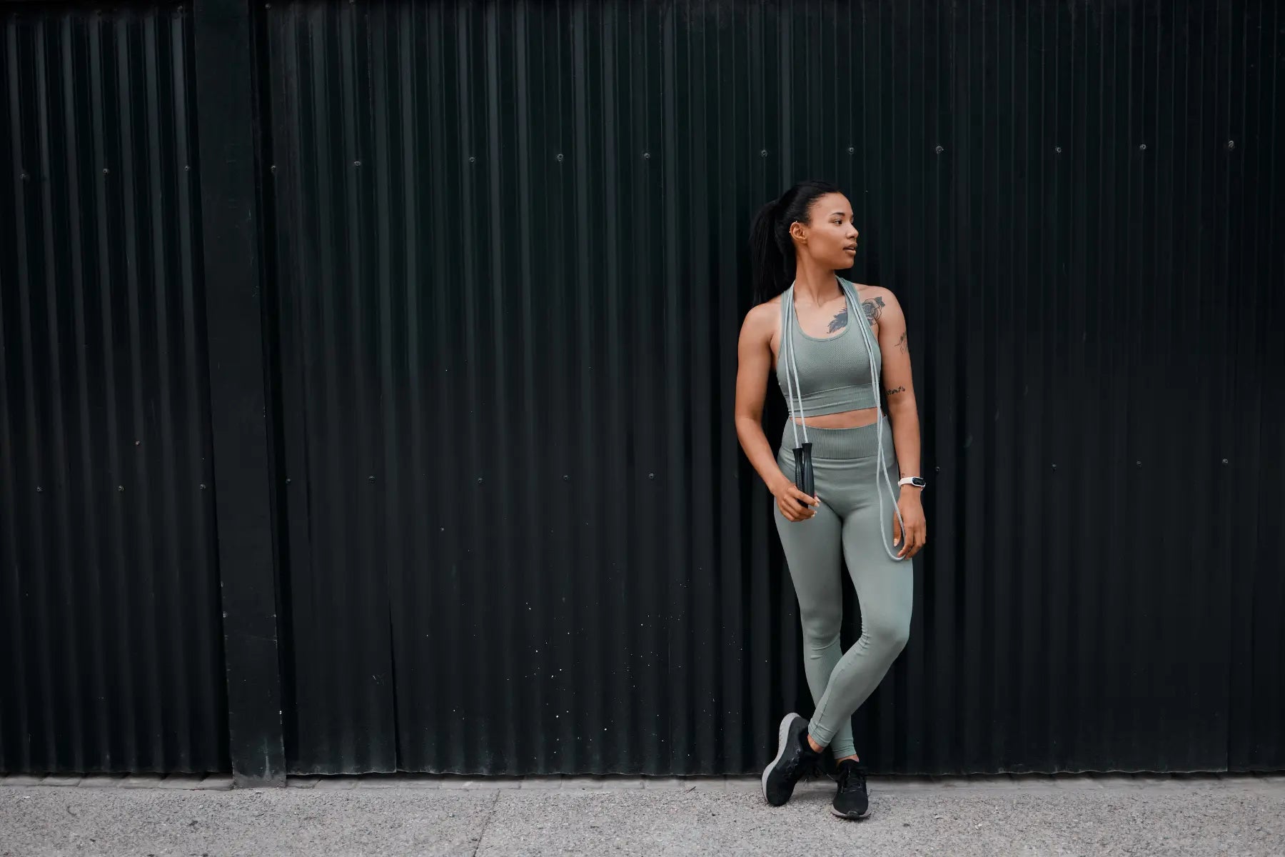 Semaglutide for fat loss represented by a fit woman in workout clothes holding a jump rope after exercise.