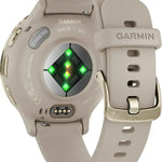 Beige Garmin smartwatch with a green digital display on a white background
