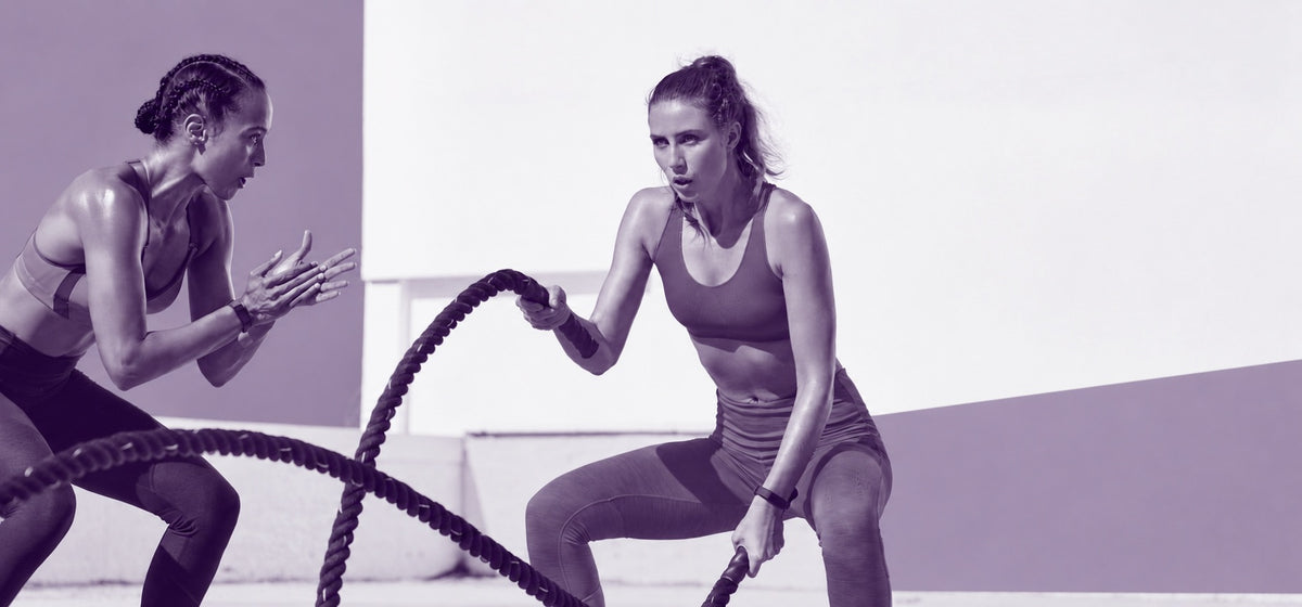 Athlete training with battle ropes