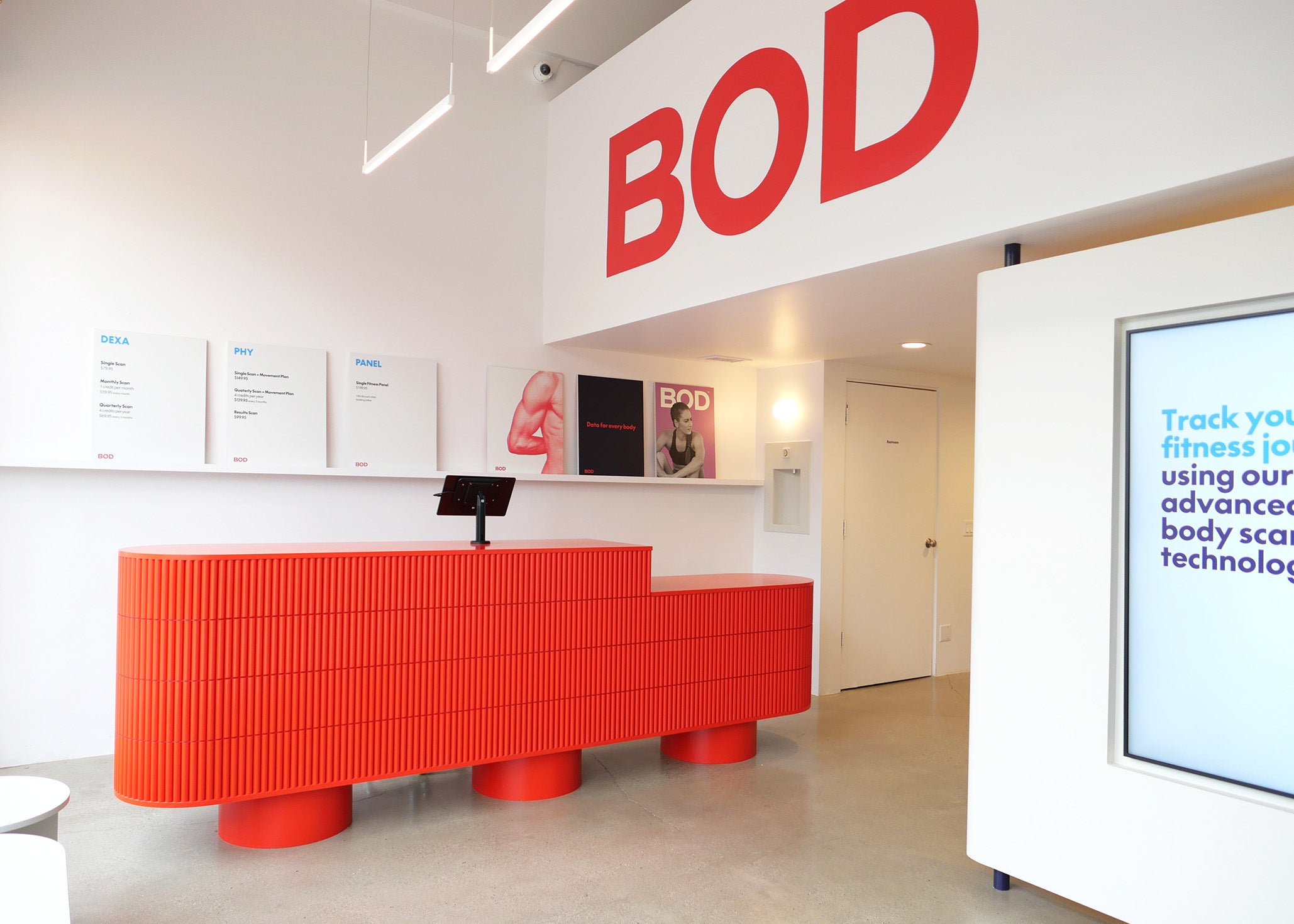 Modern interior with a red reception desk and 'BOD' branding.