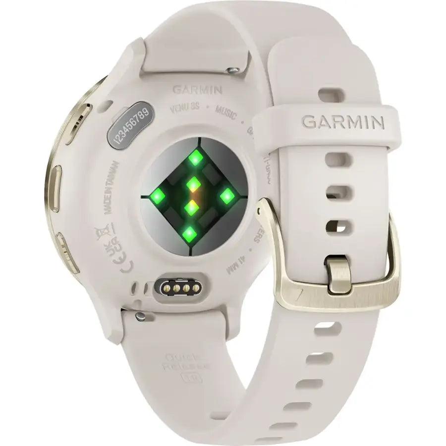White Garmin smartwatch with a green digital display on a white background